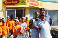Marco Paioni, owner of Snoekies and supporter of the Hout Bay Entertainers with 2 staff members